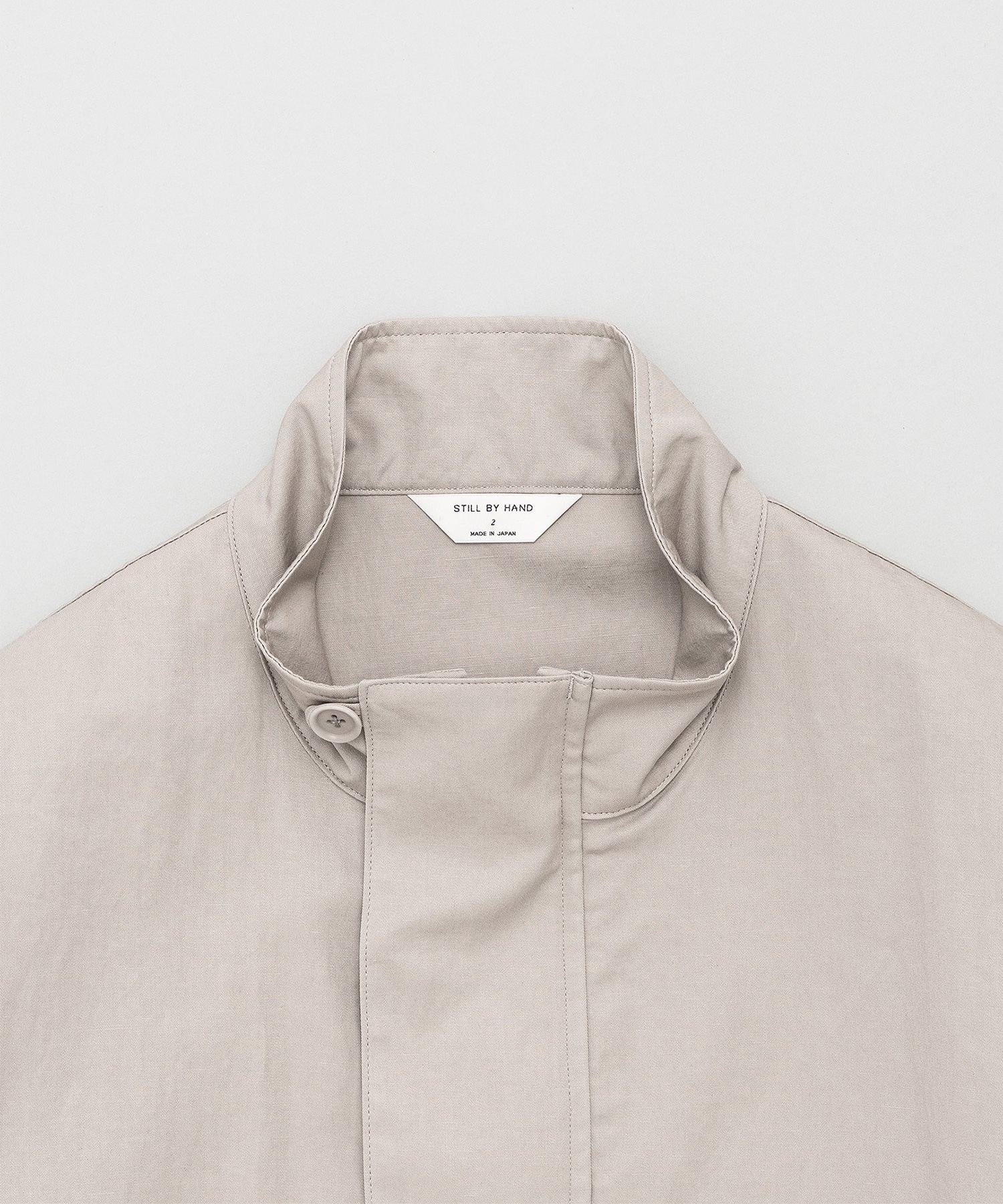 Stand collar blouson STILL BY HAND