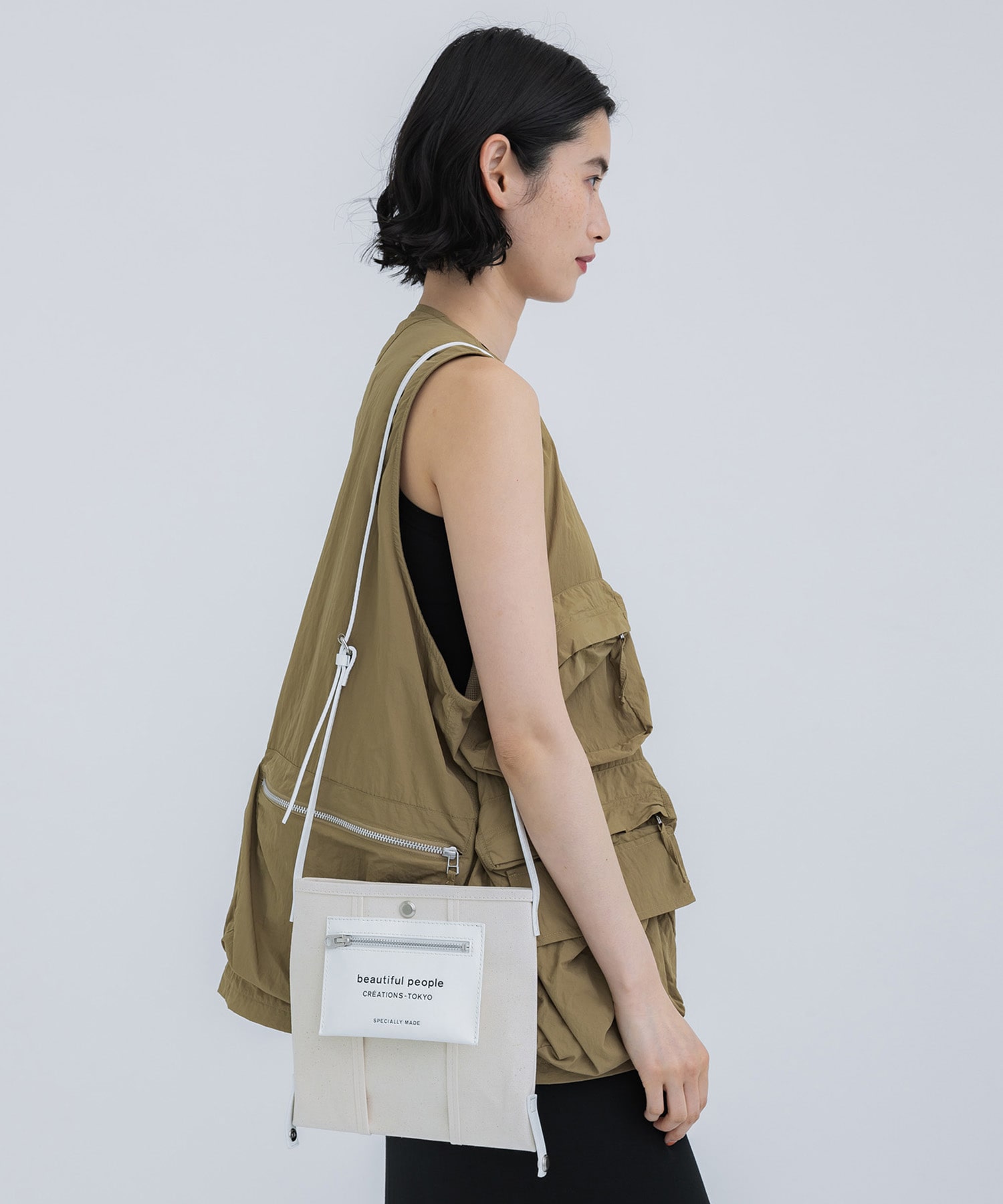 lining logo pocket mini shoulder bag beautiful people