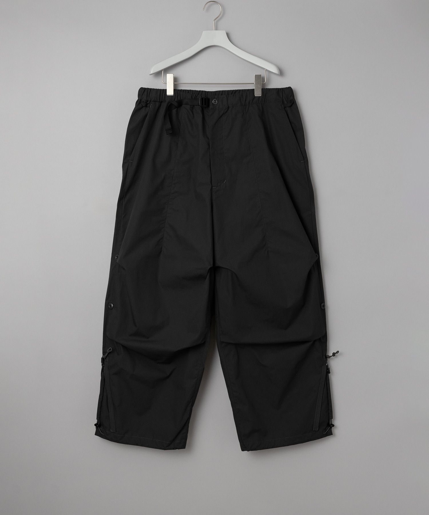 THE CHANGING LENGTH/HEM WIDE ZIP UP TUCKED PANTS